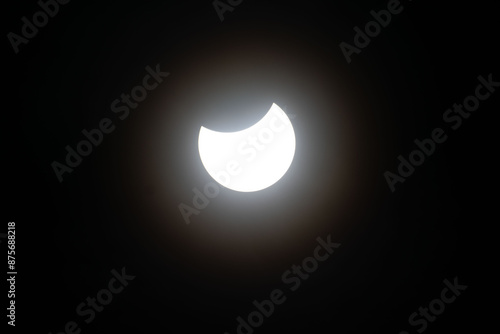 Total eclipse waning as moon begins to uncover the sun
