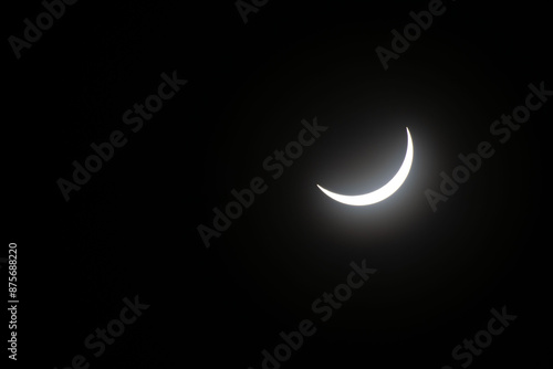 Total eclipse waning as moon begins to uncover the sun