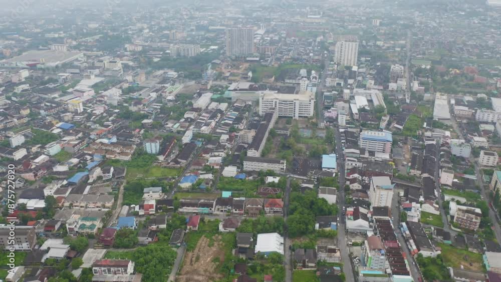Aerial view of residential neighborhood roofs with fog mist in rainy season. Urban housing development from above. Top view. Real estate in Phuket, southern province city, Thailand. Aerial view of residential neighborhood roofs with fog mist in rainy season. Urban housing development from above. Top view. Real estate in Phuket, southern province city, Thailand.