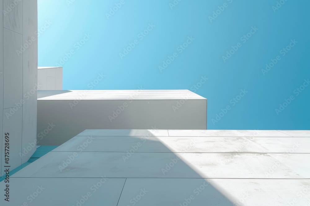 Fototapeta premium Minimalist architectural design, sharp white geometric structures under a clear blue sky, emphasizing simplicity and perspective