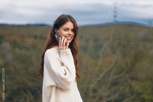 Mountain Freedom: Smiling Woman Embracing Nature and Connecting with the World through Selfie in Cyberspace © SHOTPRIME STUDIO