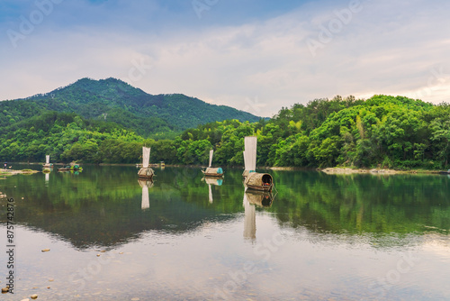 The mountains, Oujiang River, and fishing boats in Lishui City, Zhejiang Province, China photo