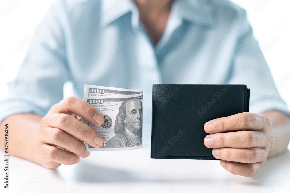 She carefully counted the dollar bills in her hand, managing her business finances and prioritizing saving for future investments. dollar, finance, money, cash, currency, bill, banknote, business. She carefully counted the dollar bills in her hand, managing her business finances and prioritizing saving for future investments. dollar, finance, money, cash, currency, bill, banknote, business.