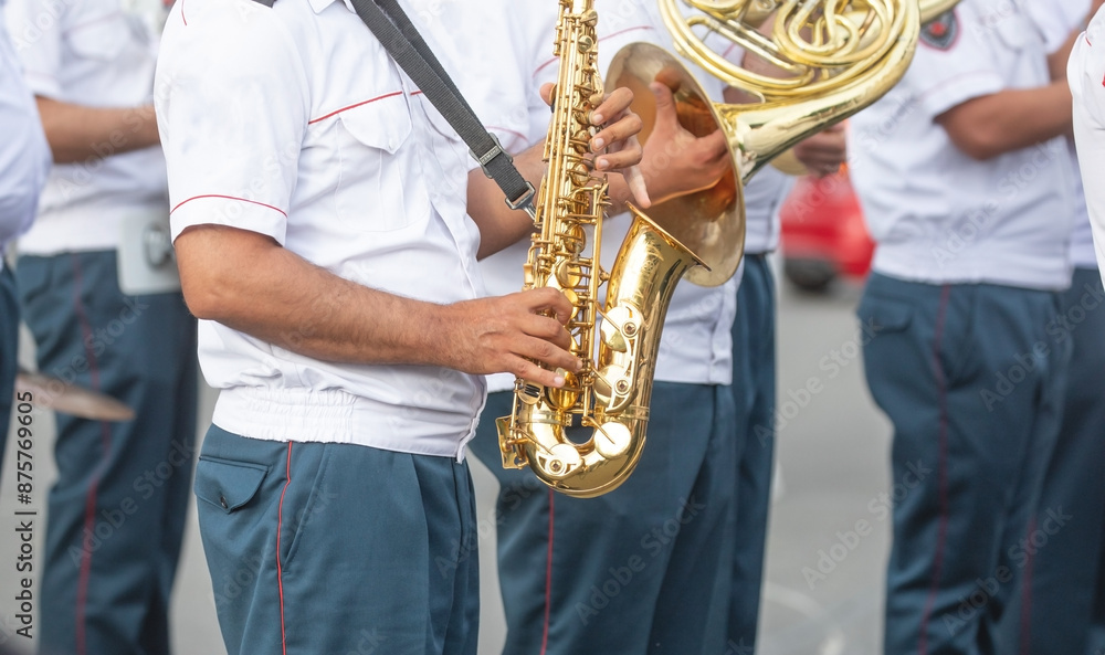 Fototapeta premium Police force officers with a musical instruments in the city.