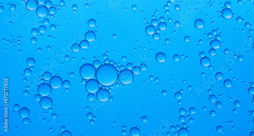 Abstract background of water drops blue bubbles of oil in liquid