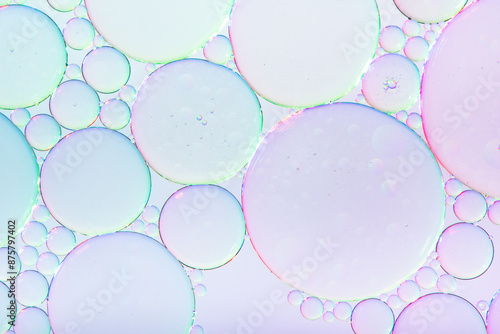 Abstract background of colorful bubbles of oil in liquid photo