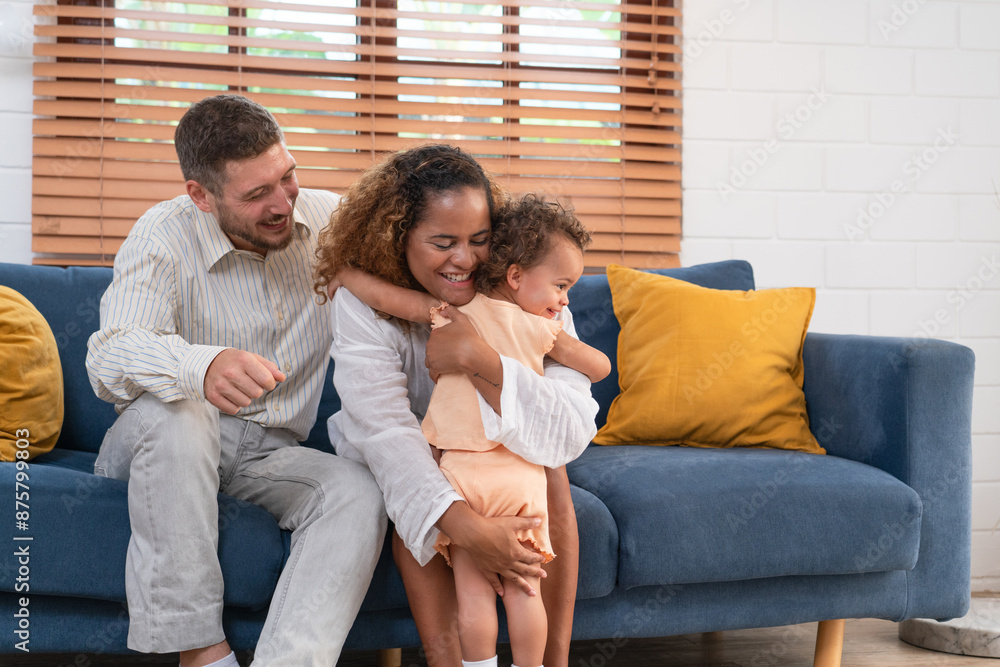 Family. Happy family with little daughte having fun at home. Smiling young parents and their child are very happy. Parenthood and people concept. Family. Happy family with little daughte having fun at home. Smiling young parents and their child are very happy. Parenthood and people concept.