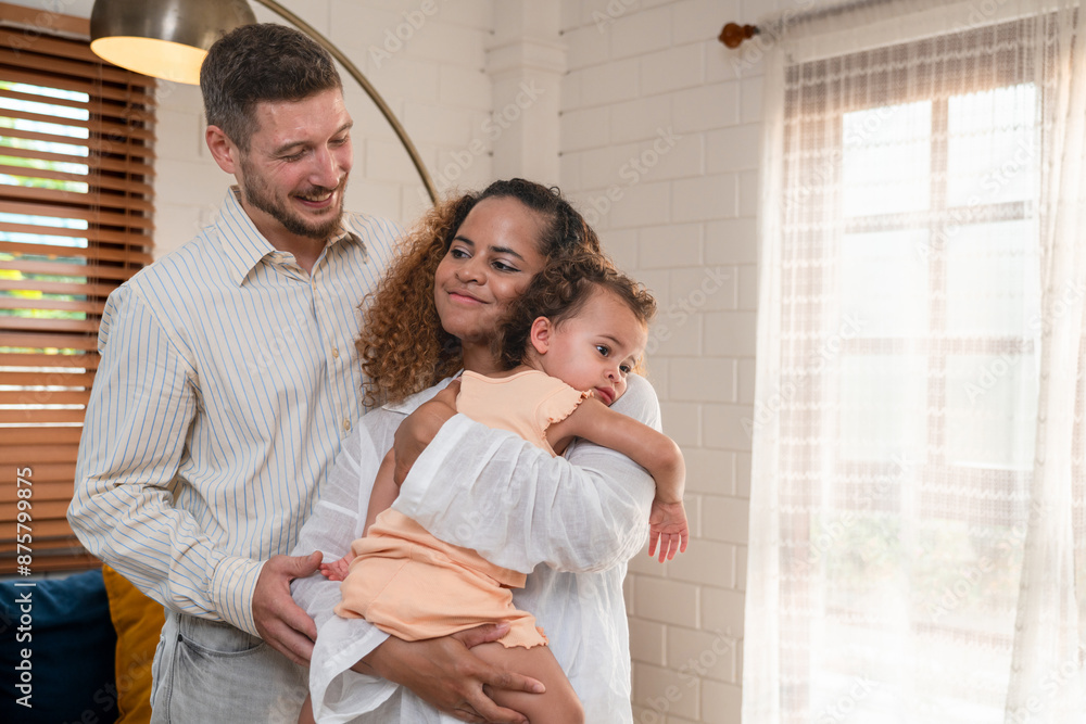 Family. Happy family with little daughte having fun at home. Smiling young parents and their child are very happy. Parenthood and people concept. Family. Happy family with little daughte having fun at home. Smiling young parents and their child are very happy. Parenthood and people concept.