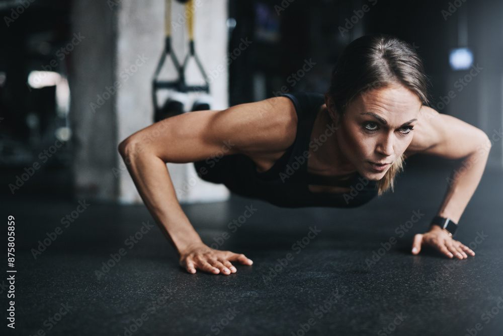 Push ups, woman and training in gym on floor for workout, health and wellness with power or resilience. Strong, athlete and exercise in sports club for fitness, competition and body goals with muscle Push ups, woman and training in gym on floor for workout, health and wellness with power or resilience. Strong, athlete and exercise in sports club for fitness, competition and body goals with muscle