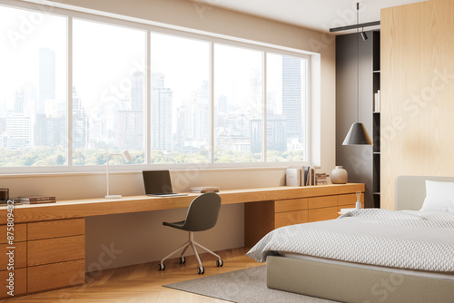 Light hotel bedroom interior with bed and workspace, panoramic window © ImageFlow