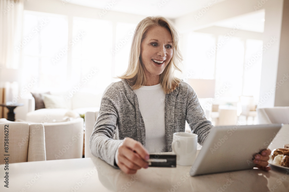 Senior woman, tablet and excited for credit card in home, banking website and wow for savings. Female person, transaction and surprise discount on purchase, ecommerce and online shopping checkout Senior woman, tablet and excited for credit card in home, banking website and wow for savings. Female person, transaction and surprise discount on purchase, ecommerce and online shopping checkout