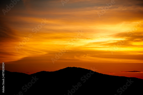 evening view of mountains covered with forest, beautiful sunset