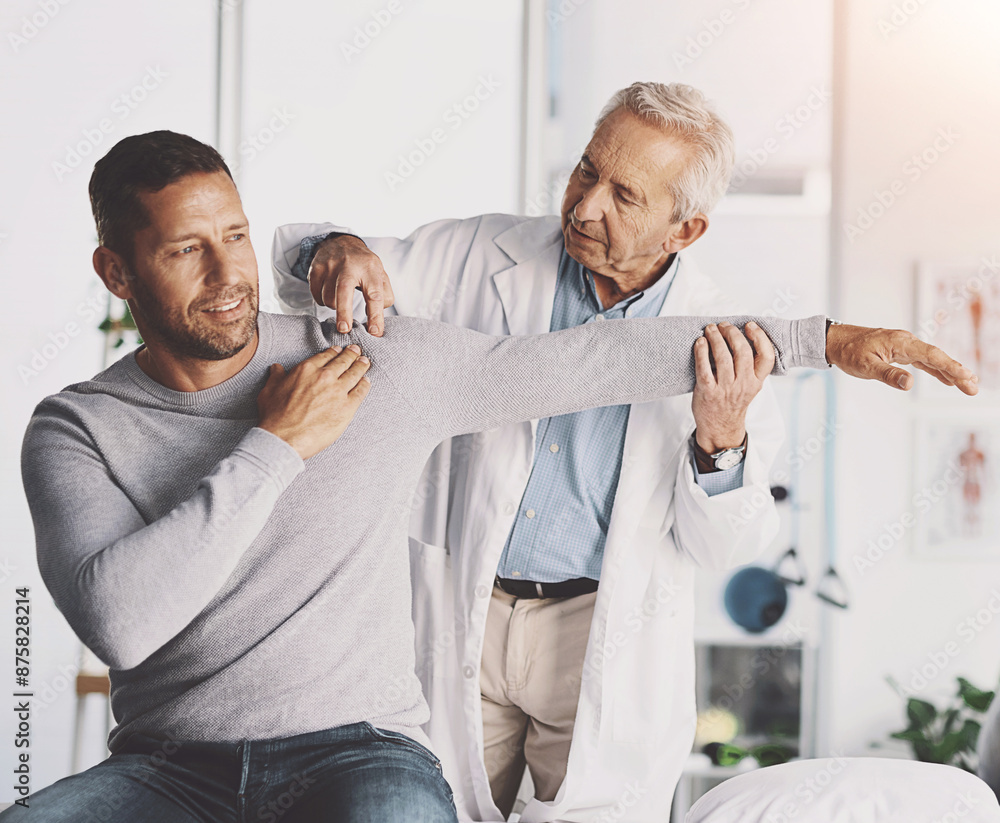 Fototapeta premium Doctor, man and patient with stretching for shoulder pain with physical therapy, examination or body recovery. Orthopedic, physician or medical expert for arm rehabilitation with healthcare or advice