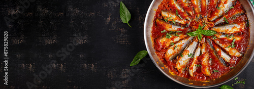 Sardines stewed in tomato sauce with spices. Lunch or dinner. Diet menu. Keto diet. Top view, banner