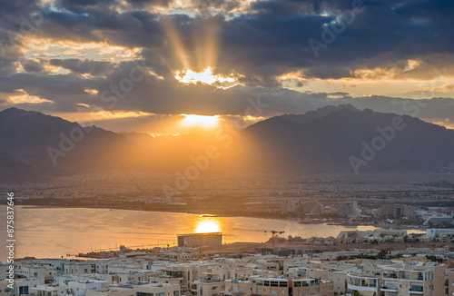 Sunrise above Eilat (Israel) and Aqaba (Jordan) cities, aerial view from surr...