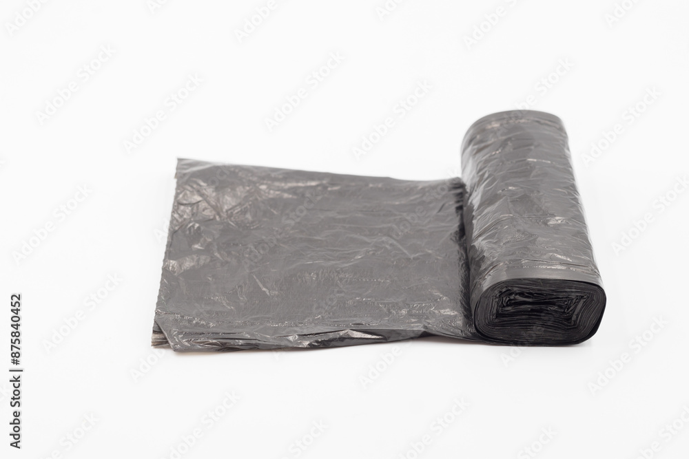 Black plastic garbage bags on white background, Roll of garbage bags on white background Black plastic garbage bags on white background, Roll of garbage bags on white background