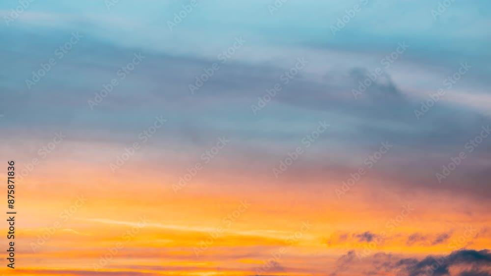 Transition To Evening Colorful Sundown. Sunset Sky Background Backdrop. Bright Dramatic Sky With Colourful Clouds. Sky In Blue Yellow Orange Pink Colors. 4K. Transition To Evening Colorful Sundown. Sunset Sky Background Backdrop. Bright Dramatic Sky With Colourful Clouds. Sky In Blue Yellow Orange Pink Colors. 4K.