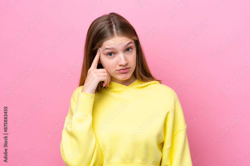 Teenager Russian girl isolated on pink background thinking an idea Teenager Russian girl isolated on pink background thinking an idea