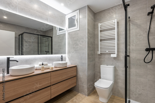 Modern bathroom with efficient lighting and contemporary fixtures, stylish and comfortable