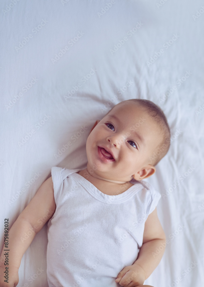Newborn, baby and happy on bed with relax for wellness, healthy development and morning routine in home. Child, infant and face or top view in bedroom with resting, wake up and comfortable on mockup Newborn, baby and happy on bed with relax for wellness, healthy development and morning routine in home. Child, infant and face or top view in bedroom with resting, wake up and comfortable on mockup