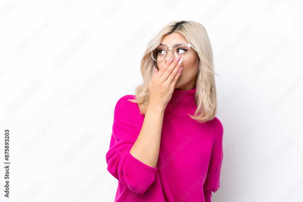 Young Russian woman isolated on white background doing surprise gesture while looking to the side Young Russian woman isolated on white background doing surprise gesture while looking to the side