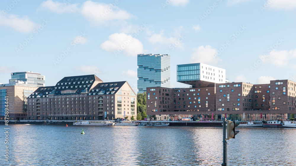 Naklejka premium waterside urban scene with modern and historic buildings in Berlin Friedrichshain
