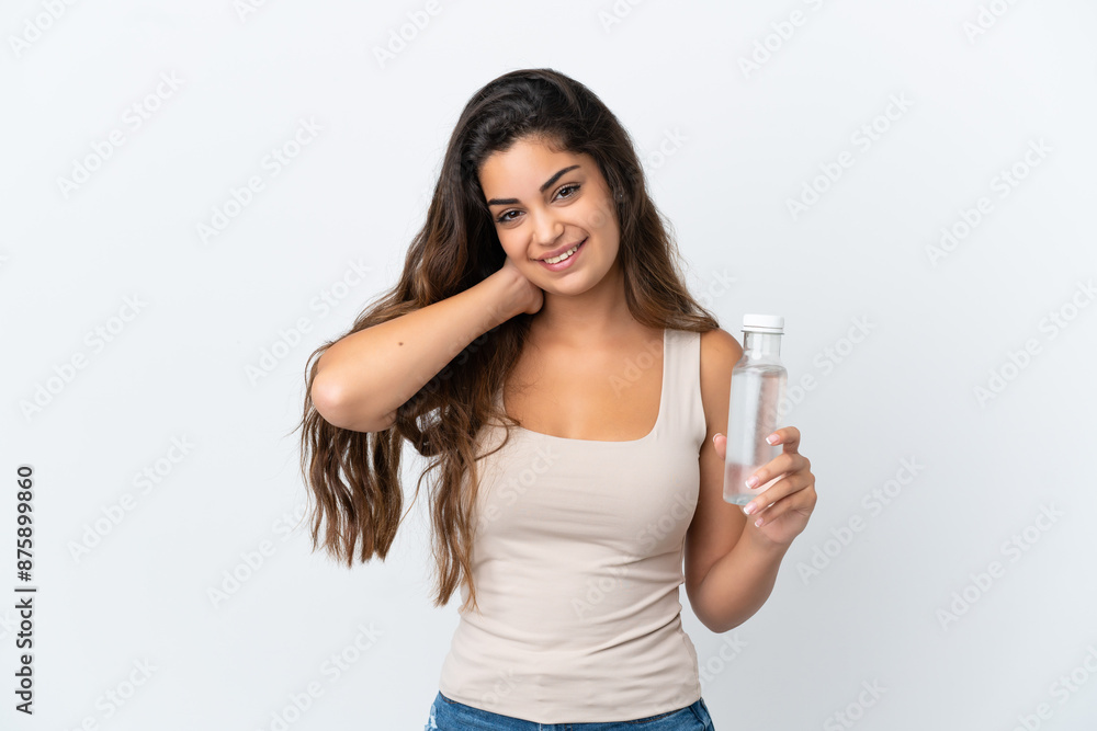 Young caucasian woman with a bottle of water isolated on white background laughing Young caucasian woman with a bottle of water isolated on white background laughing