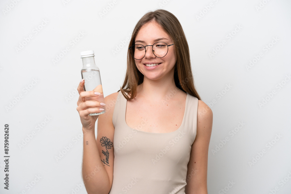 Young Lithuanian woman with a bottle of water isolated on white background with happy expression Young Lithuanian woman with a bottle of water isolated on white background with happy expression
