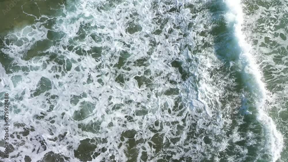Aerial view of dangerous ocean waves approaching the coast by drone Aerial view of dangerous ocean waves approaching the coast by drone