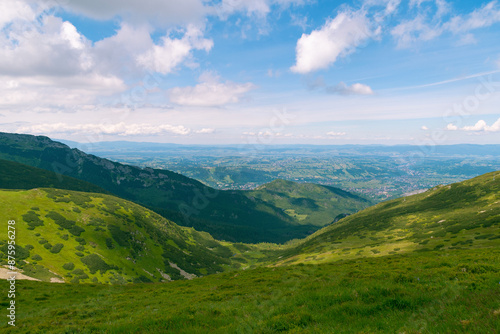 Beautiful mountain landscape overlooking the valley and the city. Tatra Mountains, Zakopane, Poland. Summer 2024. © bykot