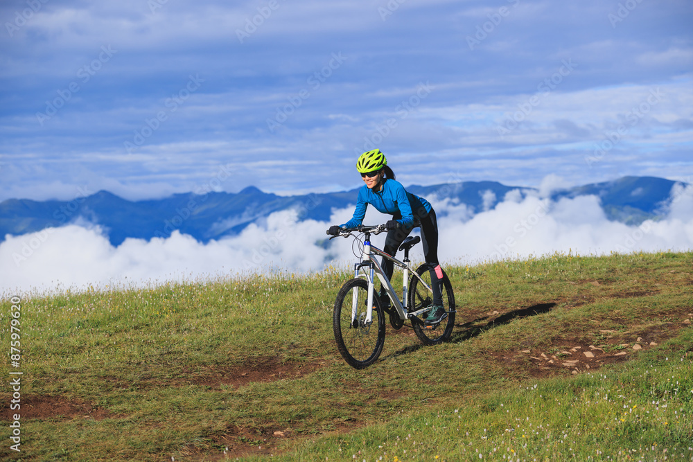 Riding mountain bike on beautiful mountain top Riding mountain bike on beautiful mountain top