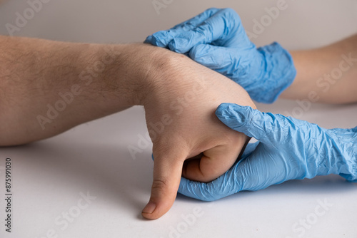 Obraz na płótnie Ganglion cyst or hygroma of the wrist on the hand of a male patient, examination