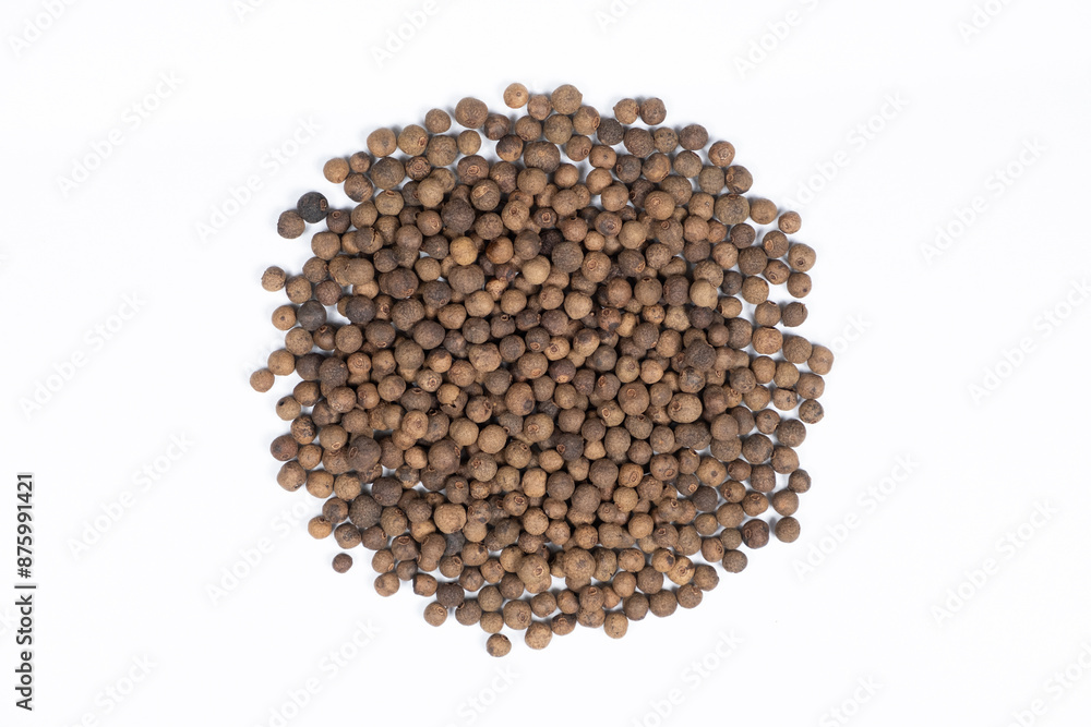 Black peppercorns close-up top view on white background. Black peppercorns close-up top view on white background.