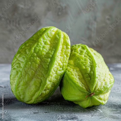 Fresh Green Chayote or Sicyos Edule also known as Christophine, Mirliton and Choko on Light Table photo