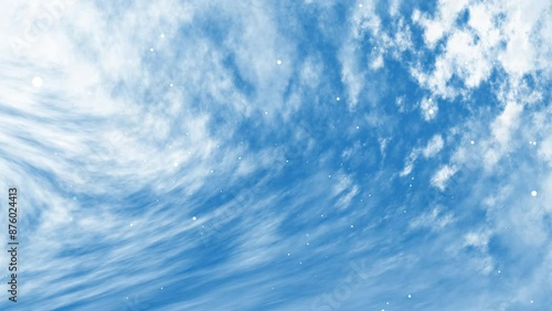 Blue sky with particle shiny objects and white wispy and puffy clouds. Suitable for backgrounds, nature concepts, weatherrelated designs, and peacefulthemed projects. photo