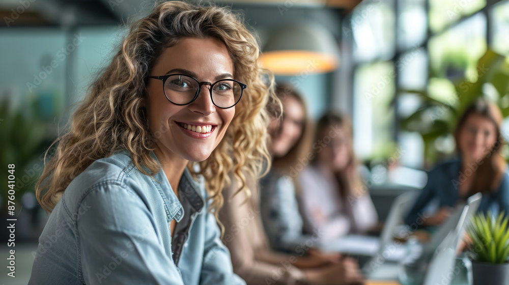 Smiling Young Businesswoman with Glasses in Modern Office Setting Smiling Young Businesswoman with Glasses in Modern Office Setting