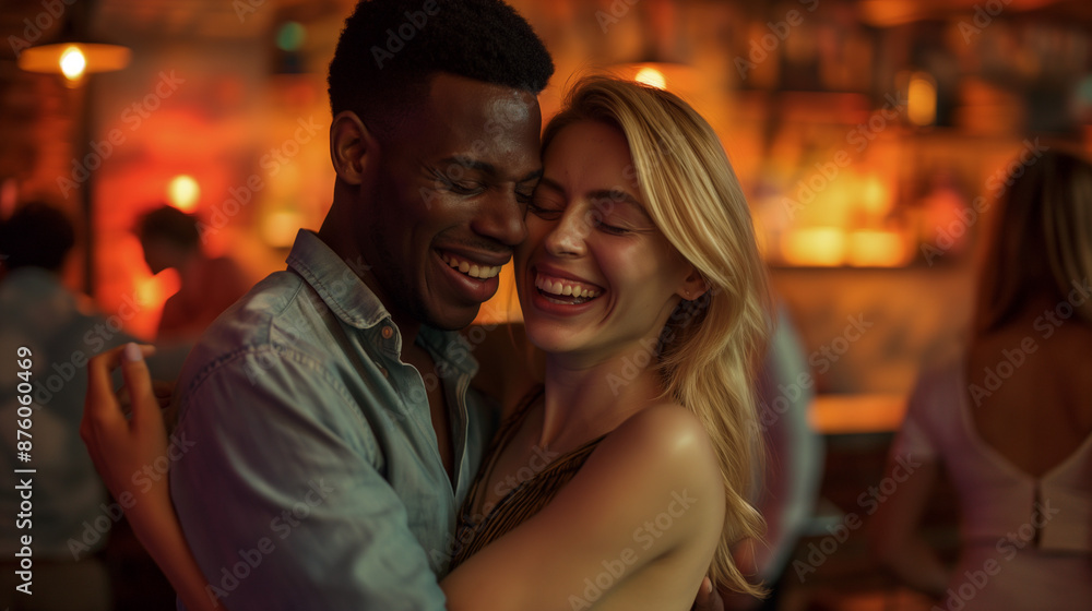 Joyful interracial couple embracing and smiling in a cozy bar. Joyful interracial couple embracing and smiling in a cozy bar.