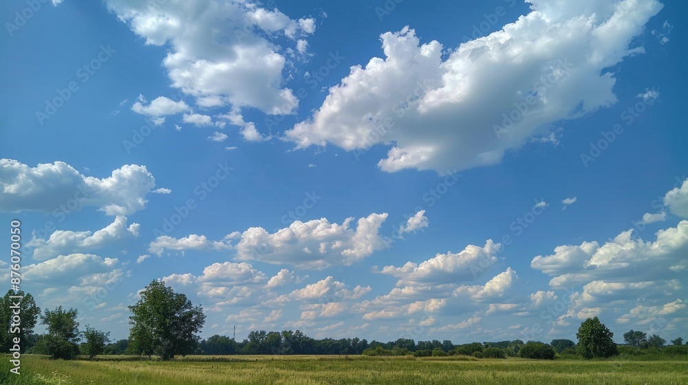 A bright blue sky with puffy white clouds. It's a perfect summer day A bright blue sky with puffy white clouds. It's a perfect summer day