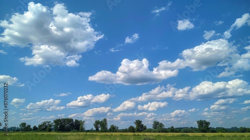 A bright blue sky with puffy white clouds. It's a perfect summer day