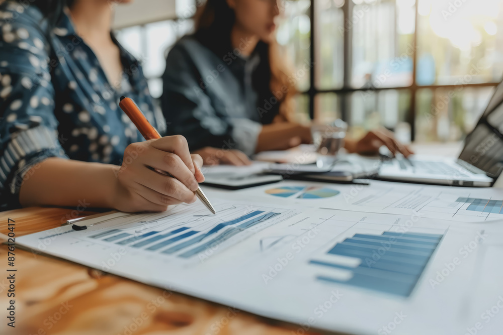 A team of business people meets to plan together for marketing the company in the office. A team of business people meets to plan together for marketing the company in the office.