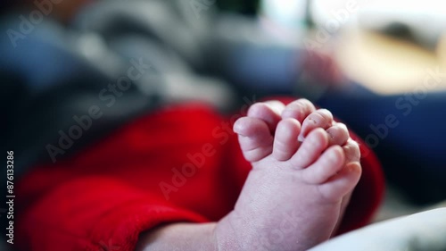 Relaxed baby resting in car seat, tiny feet, detailed view of infant’s cozy toes, peaceful and calm atmosphere, close-up shot emphasizing comfort and softness, newborn relaxation photo