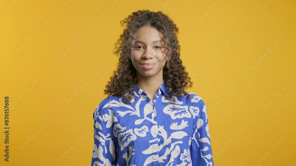Friendly african woman,yes signal,approve,agree. Positive smiling lady on yellow Friendly african woman,yes signal,approve,agree. Positive smiling lady on yellow
