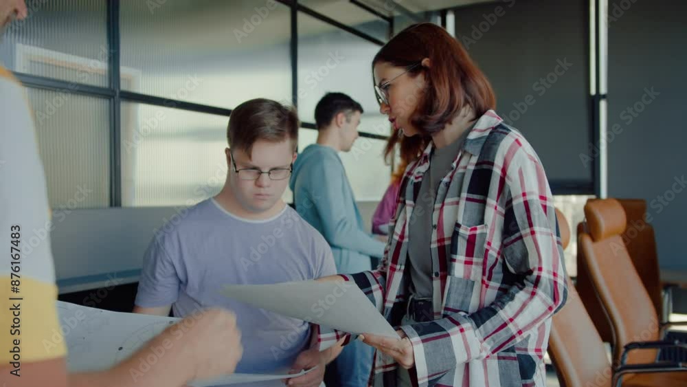 Woman reading data from papers to diverse colleagues Woman reading data from papers to diverse colleagues