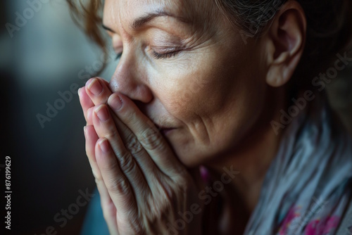 Wallpaper Mural Elderly white woman with hands clasped in prayer, eyes closed, conveying peace and introspection, concept of faith and meditation, includes Thanksgiving Torontodigital.ca