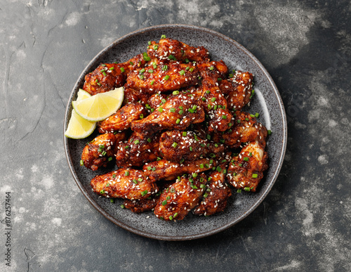 Spicy korean chicken wings with sesame seeds and chives