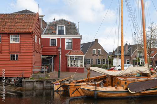 Fotografie Old harbor in the fishing village Spakenburg with old traditional wooden botter fishing boat