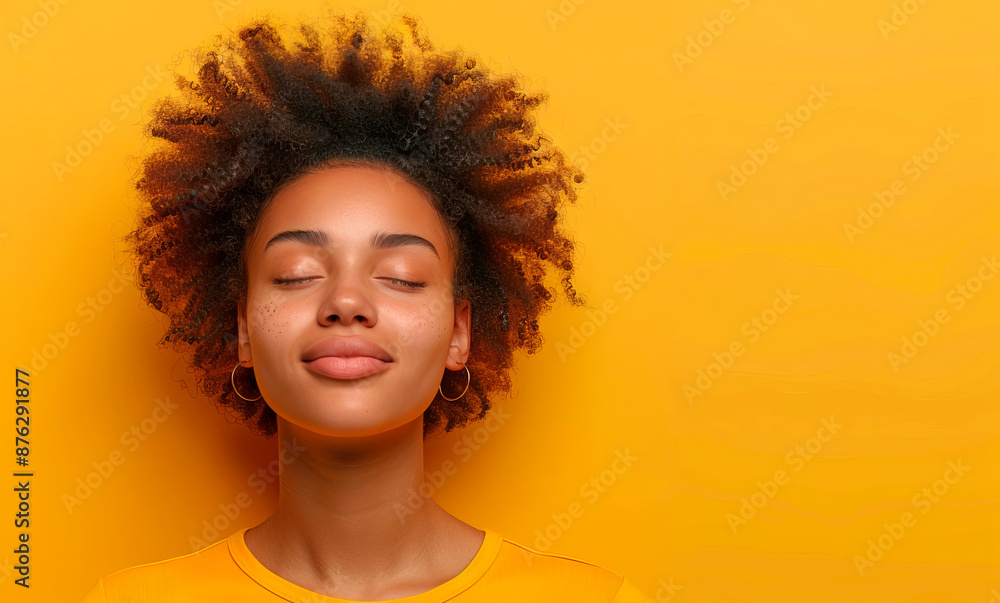smiling dark-skinned beautiful model in yellow clothes on a bright plain background. Concept: vitality, emotions of girls. Banner copy smiling dark-skinned beautiful model in yellow clothes on a bright plain background. Concept: vitality, emotions of girls. Banner copy