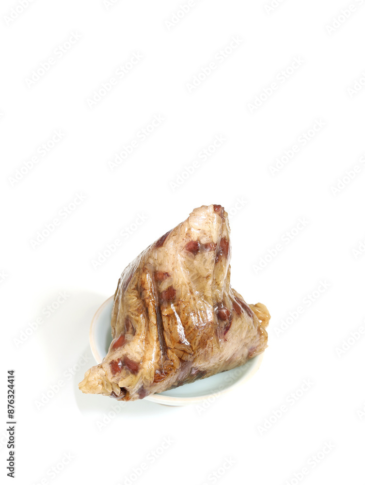 Zongzi, a traditional Chinese dish for the Dragon Boat Festival, on a white table Zongzi, a traditional Chinese dish for the Dragon Boat Festival, on a white table