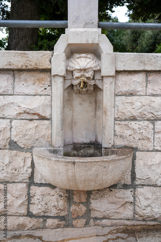 Old fountain in the limestone walls of Locorotondo Old fountain in the limestone walls of Locorotondo
