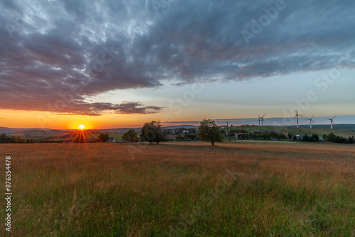 Meadows with sunset in Krusne mountains in evening in Nova Ves v Horach village photo